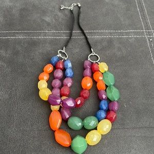 Three strand multiple length beaded necklace